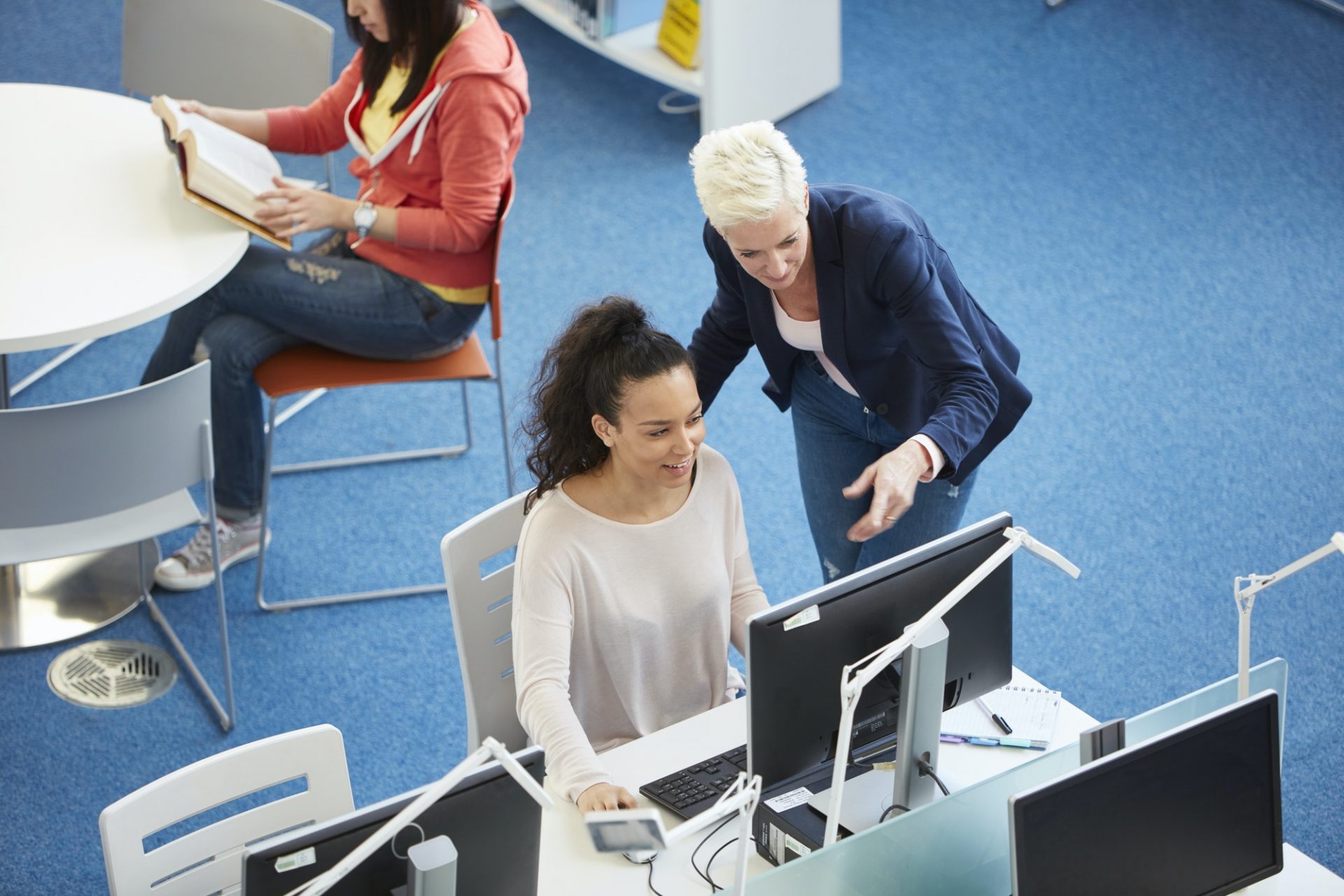 University students working in library