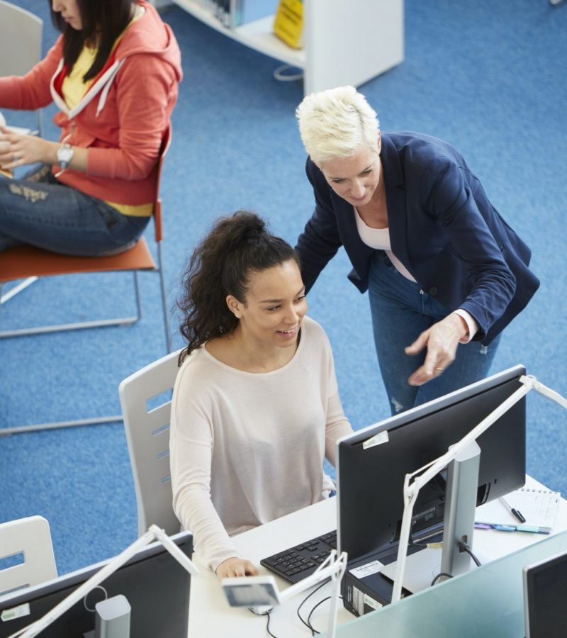 University students working in library